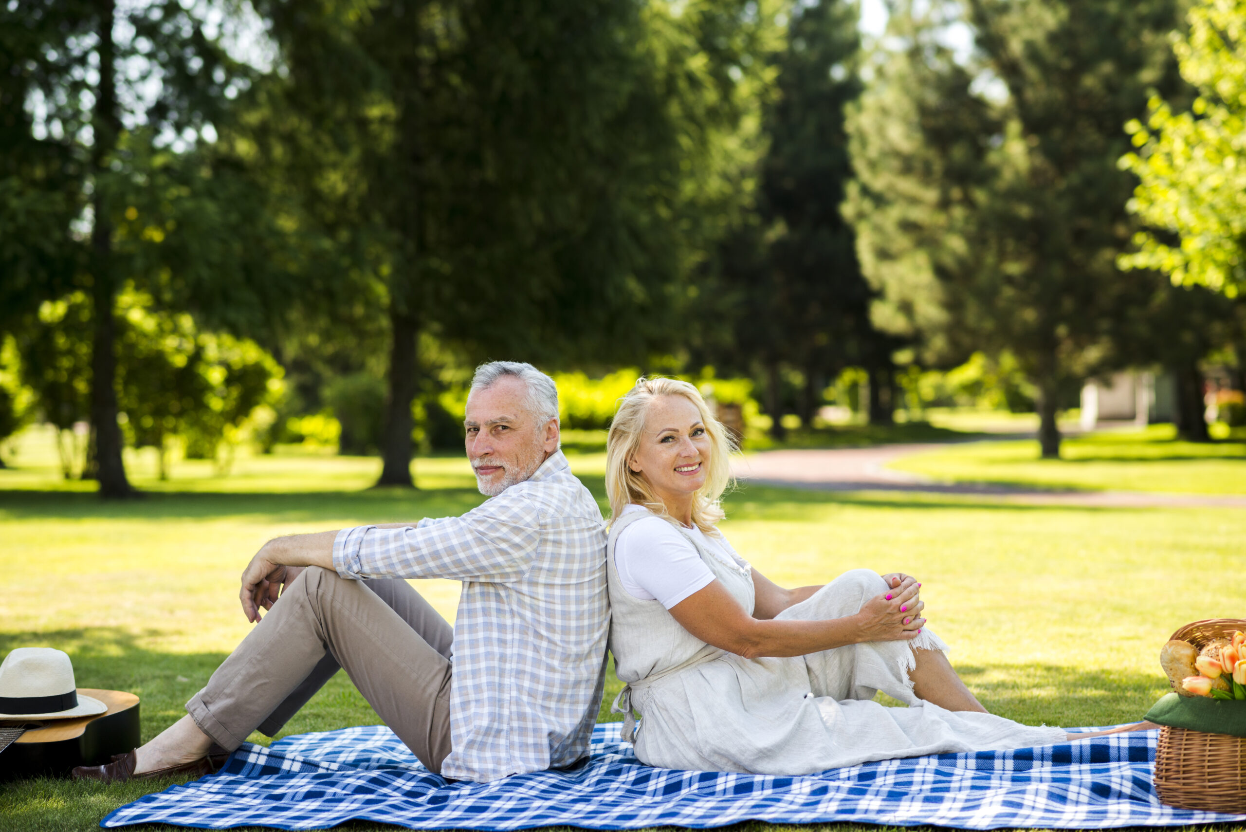 Elderly couple enjoying sunlight, representing the importance of Vitamin D for seniors' health.