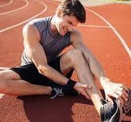 Runner experiencing muscle cramps due to low sodium levels, emphasizing the importance of balanced sodium intake.